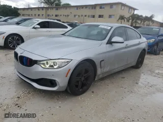 2015 BMW 4 Series 428i xDrive with VIN WBA4C9C59FD330853, listed as a Copart auction lot 52130785 with 128,618 mi miles and Salvage Title. Bid and sale history available at carsss.com. Image 1.