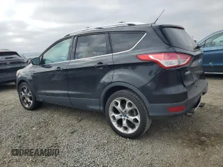 2014 Ford Escape Titanium with VIN 1FMCU9J90EUC89590, listed as a Copart auction lot 43985065 with 128,878 mi miles and Salvage Title. Bid and sale history available at carsss.com. Image 2.