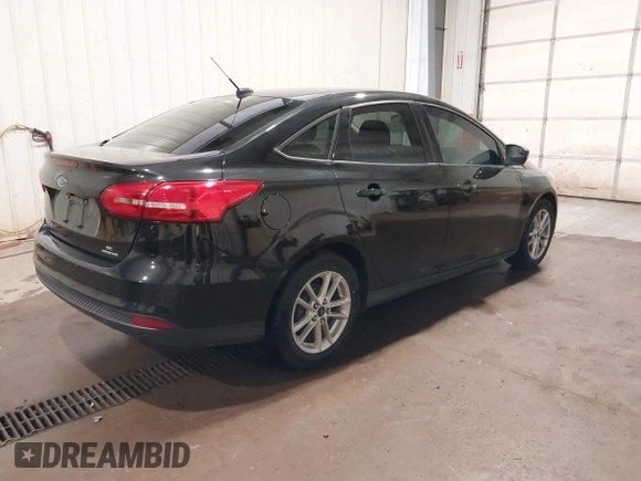 2015 Ford Focus SE with VIN 1FADP3F29FL203084, listed as a IAAI auction lot 42357973 with 99,002 mi miles and . Bid and sale history available at DreamBid. Image 4.
