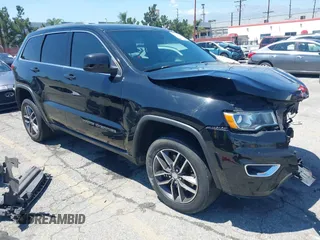 2018 Jeep Grand Cherokee Laredo E with VIN 1C4RJEAG9JC131344, listed as a IAAI auction lot 42218060 with 126,639 mi miles and . Bid and sale history available at DreamBid. Image 1.