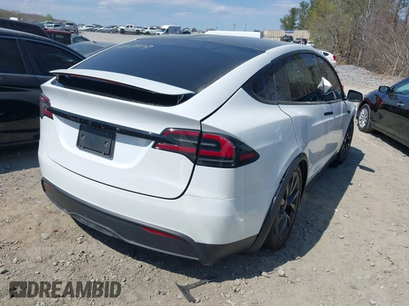 2023 Tesla Model X with VIN 7SAXCDE50PF414198, listed as a IAAI auction lot 41880957 with Not Provided miles and . Bid and sale history available at DreamBid. Image 4.