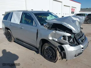 2018 Chevrolet Tahoe Commercial with VIN 1GNSKDEC1JR340887, listed as a IAAI auction lot 41044038 with 99,500 mi miles. Bid and sale history available at carsss.com. Image 1.