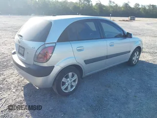 2009 Kia Rio LX with VIN KNADE243096440150, listed as a IAAI auction lot 42152589 with 114,484 mi miles. Bid and sale history available at carsss.com. Image 4.
