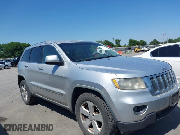2012 Jeep Grand Cherokee Laredo with VIN 1C4RJEAG5CC112230, listed as a IAAI auction lot 41997483 with 302,923 mi miles. Bid and sale history available at carsss.com. Image 13.