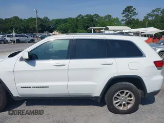2020 Jeep Grand Cherokee Laredo E with VIN 1C4RJFAG1LC389026, listed as a IAAI auction lot 42261396 with 100,409 mi miles and . Bid and sale history available at DreamBid. Image 14.
