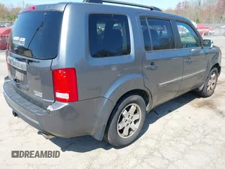 2011 Honda Pilot Touring with VIN 5FNYF4H94BB035415, listed as a IAAI auction lot 42126738 with 239,273 mi miles. Bid and sale history available at carsss.com. Image 4.