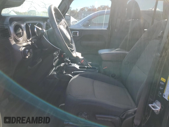 2023 Jeep Wrangler Sport with VIN 1C4HJXDN9PW512460, listed as a Copart auction lot 77107894 with 23,142 mi miles and Salvage Title. Bid and sale history available at DreamBid. Image 7.