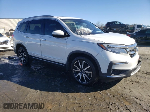 2021 Honda Pilot Touring 8-Passenger with VIN 5FNYF5H94MB001855, listed as a Copart auction lot 87891185 with 55,097 mi miles and Salvage Title. Bid and sale history available at DreamBid. Image 4.