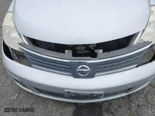 2009 Nissan Versa 1.8 S with VIN 3N1BC13E09L406828, listed as a IAAI auction lot 42075391 with 136,671 mi miles. Bid and sale history available at carsss.com. Image 6.