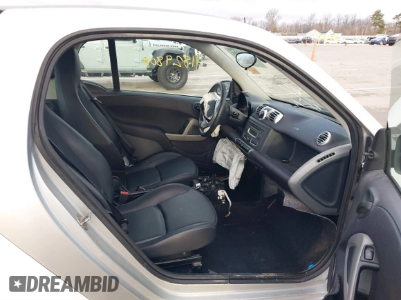 2013 Smart fortwo Pure with VIN WMEEJ3BA2DK702004, listed as a IAAI auction lot 41829808 with 53,545 mi miles and . Bid and sale history available at DreamBid. Image 8.