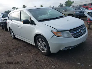 2012 Honda Odyssey Touring with VIN 5FNRL5H95CB106237, listed as a IAAI auction lot 42663620 with 224,426 mi miles and . Bid and sale history available at DreamBid. Image 1.