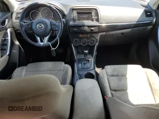 2014 Mazda CX-5 Touring with VIN JM3KE2CY9E0305244, listed as a Copart auction lot 56205605 with 164,516 mi miles and Salvage Title. Bid and sale history available at DreamBid. Image 8.