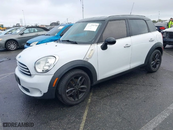 2011 MINI Cooper Countryman with VIN WMWZB3C54BWM00926, listed as a IAAI auction lot 41523122 with 109,909 mi miles. Bid and sale history available at carsss.com. Image 2.