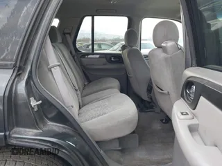 2005 GMC Envoy SLT with VIN 1GKDT13S352258833, listed as a IAAI auction lot 41525149 with 213,829 mi miles. Bid and sale history available at carsss.com. Image 8.