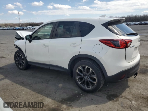 2016 Mazda CX-5 Grand Touring z VIN JM3KE2DY9G0645141, wystawiony jako Copart lot #50989635 z przebiegiem 123 898 mil mil oraz Szkoda całkowita • Salvage title. Historia ofert i sprzedaży dostępna na DreamBid. Obrazek 2.