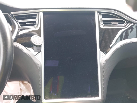 2013 Tesla Model S with VIN 5YJSA1CG9DFP27357, listed as a IAAI auction lot 42362514 with Not provided miles and . Bid and sale history available at DreamBid. Image 18.
