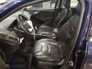 2016 Ford Focus Titanium z VIN 1FADP3J27GL310367, wystawiony jako Copart lot #55048005 z przebiegiem 86 676 mil mil oraz Szkoda całkowita • Salvage title. Historia ofert i sprzedaży dostępna na DreamBid. Obrazek 7.