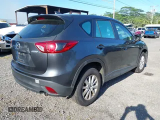 2014 Mazda CX-5 Sport with VIN JM3KE2BE8E0313407, listed as a IAAI auction lot 41215428 with 120,387 mi miles and . Bid and sale history available at carsss.com. Image 4.