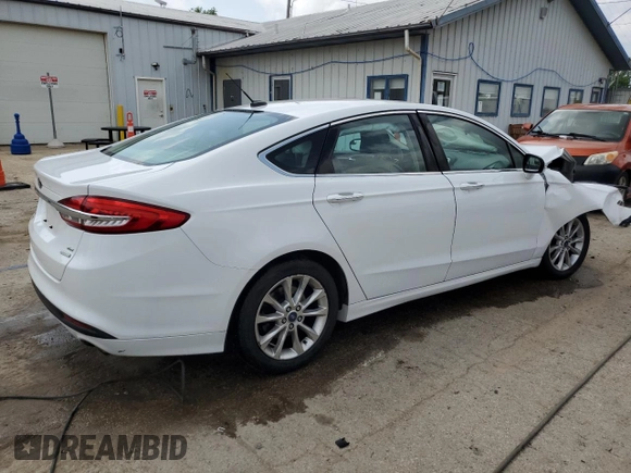2017 Ford Fusion SE with VIN 3FA6P0HD1HR115897, listed as a Copart auction lot 61087315 with 124,311 mi miles and Salvage title. Bid and sale history available at DreamBid. Image 3.