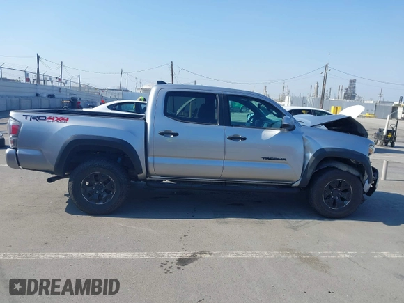 2021 Toyota Tacoma SR with VIN 5TFCZ5AN6MX270972, listed as a IAAI auction lot 42460823 with 76,062 mi miles and . Bid and sale history available at DreamBid. Image 14.