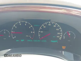 2004 Cadillac DeVille DHS z VIN 1G6KE57Y24U260694, wystawiony jako IAAI lot #42235533 z przebiegiem 156 689 mil mil oraz . Historia ofert i sprzedaży dostępna na DreamBid. Obrazek 7.