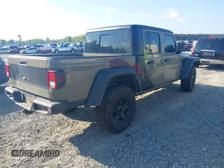 2020 Jeep Gladiator Sport S with VIN 1C6HJTAG0LL216406, listed as a IAAI auction lot 41991629 with 180,125 mi miles and . Bid and sale history available at DreamBid. Image 4.