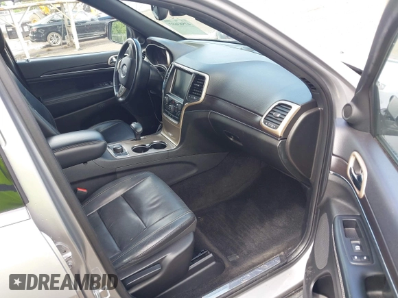 2014 Jeep Grand Cherokee Limited with VIN 1C4RJFBGXEC517832, listed as a IAAI auction lot 42583697 with 107,719 mi miles and . Bid and sale history available at DreamBid. Image 5.