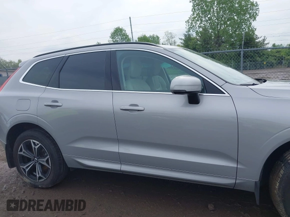 2022 Volvo XC60 Momentum z VIN YV4L12RK0N1997610, wystawiony jako IAAI lot #42202592 z przebiegiem 3580 mil mil oraz . Historia ofert i sprzedaży dostępna na DreamBid. Obrazek 13.