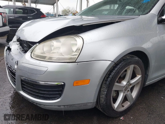 2009 Volkswagen Jetta S z VIN 3VWJZ71K29M148712, wystawiony jako IAAI lot #41724523 z przebiegiem 112 043 mil mil oraz . Historia ofert i sprzedaży dostępna na DreamBid. Obrazek 14.