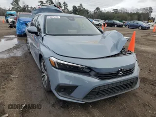 2023 Honda Civic Sedan Touring with VIN 2HGFE1F95PH313835, listed as a Copart auction lot 45145875 with 52,344 mi miles and Salvage Title. Bid and sale history available at carsss.com. Image 5.
