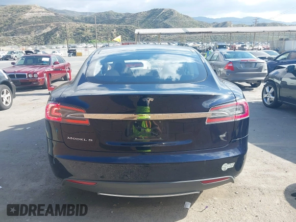 2013 Tesla Model S with VIN 5YJSA1CN8DFP07177, listed as a IAAI auction lot 42127797 with 75,227 mi miles and . Bid and sale history available at DreamBid. Image 17.