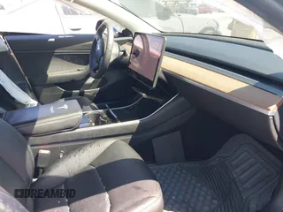 2020 Tesla Model 3 Standard Range Plus with VIN 5YJ3E1EA1LF590396, listed as a IAAI auction lot 41868089 with 51,278 mi miles. Bid and sale history available at carsss.com. Image 5.