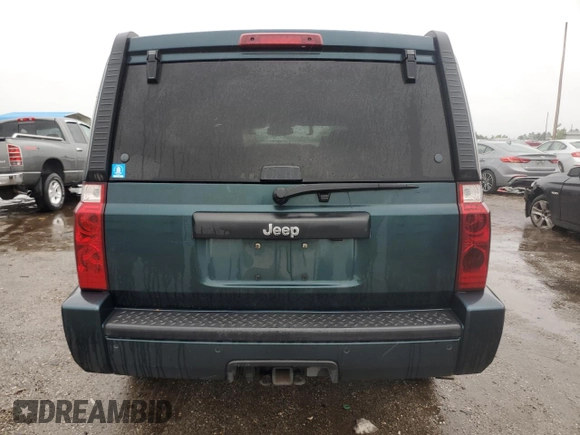 2006 Jeep Commander with VIN 1J8HH48NX6C125803, listed as a Copart auction lot 71247304 with 214,297 mi miles and Salvage Title. Bid and sale history available at carsss.com. Image 6.