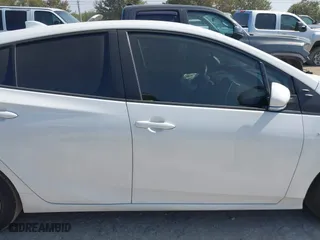 2021 Toyota Prius L Eco with VIN JTDKAMFU6M3141263, listed as a IAAI auction lot 40593951 with 95,921 mi miles. Bid and sale history available at carsss.com. Image 13.