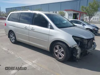 2009 Honda Odyssey Touring с VIN 5FNRL38969B013708, выставлен на аукционе IAAI как лот 42002538 с пробегом 198 220 миль миль и . История ставок и продаж доступна на DreamBid. Изображение 1.
