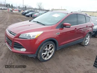 2014 Ford Escape Titanium with VIN 1FMCU0JXXEUB96456, listed as a IAAI auction lot 41700975 with 137,521 mi miles. Bid and sale history available at carsss.com. Image 2.