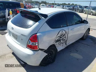 2007 Hyundai Accent GS with VIN KMHCM36C47U050161, listed as a IAAI auction lot 41762927 with 111,684 mi miles. Bid and sale history available at carsss.com. Image 6.