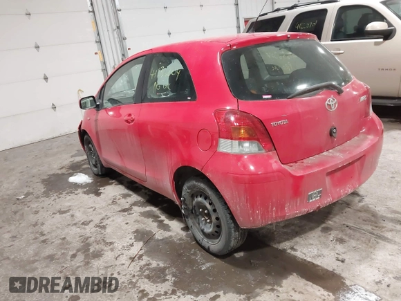 2009 Toyota Yaris with VIN JTDJT903695262292, listed as a IAAI auction lot 41636204 with 157,986 mi miles. Bid and sale history available at carsss.com. Image 3.