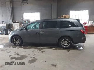 2012 Honda Odyssey EX-L with VIN 5FNRL5H63CB137198, listed as a IAAI auction lot 42706690 with 305,753 mi miles and . Bid and sale history available at DreamBid. Image 14.