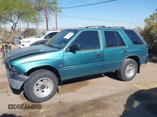 1995 Isuzu Rodeo LS z VIN 4S2CY58V6S4316697, wystawiony jako IAAI lot #42103936 z przebiegiem 143 185 mil mil oraz . Historia ofert i sprzedaży dostępna na DreamBid. Obrazek 13.