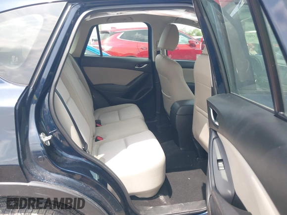 2016 Mazda CX-5 Sport z VIN JM3KE2BY0G0633611, wystawiony jako IAAI lot #42390654 z przebiegiem Nie podano mil oraz . Historia ofert i sprzedaży dostępna na DreamBid. Obrazek 8.