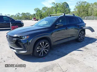 2023 Mazda CX-50 2.5 Turbo with VIN 7MMVABXY1PN126178, listed as a IAAI auction lot 41707411 with 27,179 mi miles. Bid and sale history available at carsss.com. Image 2.