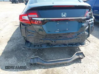 2018 Honda Clarity Touring z VIN JHMZC5F32JC001730, wystawiony jako IAAI lot #41718456 z przebiegiem 64 619 mil mil oraz . Historia ofert i sprzedaży dostępna na DreamBid. Obrazek 6.