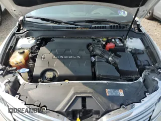 2015 Lincoln MKZ z VIN 3LN6L2GK9FR622783, wystawiony jako Copart lot #59892995 z przebiegiem 174 209 mil mil oraz Szkoda całkowita • Salvage title. Historia ofert i sprzedaży dostępna na DreamBid. Obrazek 11.