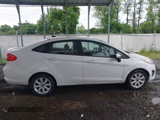2011 Ford Fiesta SE z VIN 3FADP4BJ5BM207676, wystawiony jako IAAI lot #42263307 z przebiegiem 139 929 mil mil oraz . Historia ofert i sprzedaży dostępna na DreamBid. Obrazek 13.