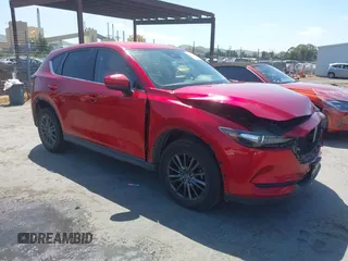 2019 Mazda CX-5 Touring with VIN JM3KFACM5K1516242, listed as a IAAI auction lot 42019803 with 113,953 mi miles. Bid and sale history available at carsss.com. Image 1.
