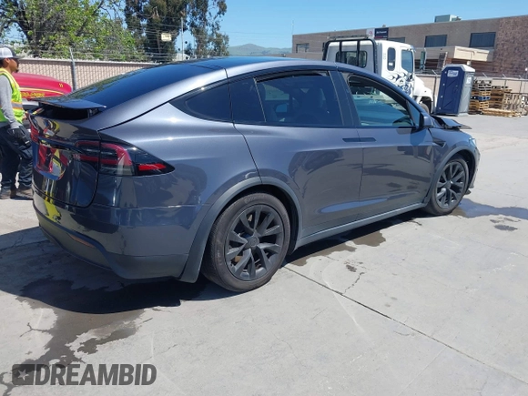 2022 Tesla Model X with VIN 7SAXCAE59NF360301, listed as a IAAI auction lot 41945059 with Not Provided miles and . Bid and sale history available at DreamBid. Image 4.