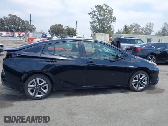 2017 Toyota Prius Two with VIN JTDKARFUXH3041668, listed as a IAAI auction lot 42421754 with 57,677 mi miles and . Bid and sale history available at DreamBid. Image 14.