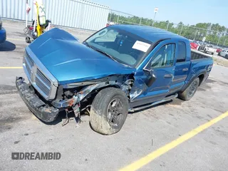 2005 Dodge Dakota SLT with VIN 1D7HW48N05S319621, listed as a IAAI auction lot 42037140 with 251,595 mi miles and . Bid and sale history available at DreamBid. Image 2.