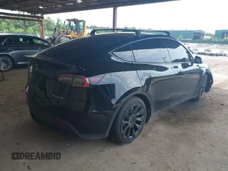 2023 Tesla Model Y Long Range with VIN 7SAYGDEE3PA185778, listed as a IAAI auction lot 39721611 with 11,986 mi miles and . Bid and sale history available at DreamBid. Image 4.